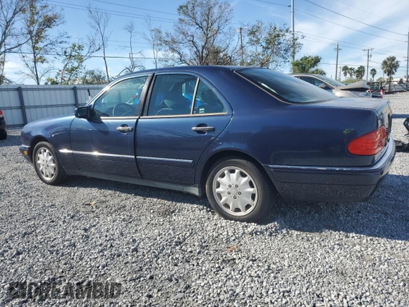 1998 Mercedes-Benz E-Class with VIN WDBJF65F3WA642006, listed as a Copart auction lot 87309994 with 129,837 mi miles and Salvage Title. Bid and sale history available at carsss.com. Image 2.