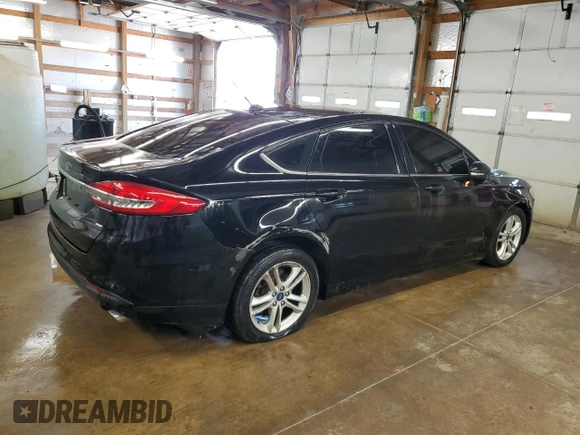 2018 Ford Fusion SE z VIN 3FA6P0H77JR277923, wystawiony jako Copart lot #56897455 z przebiegiem 154 432 mil mil oraz Czysty tytuł • Clean title. Historia ofert i sprzedaży dostępna na DreamBid. Obrazek 3.