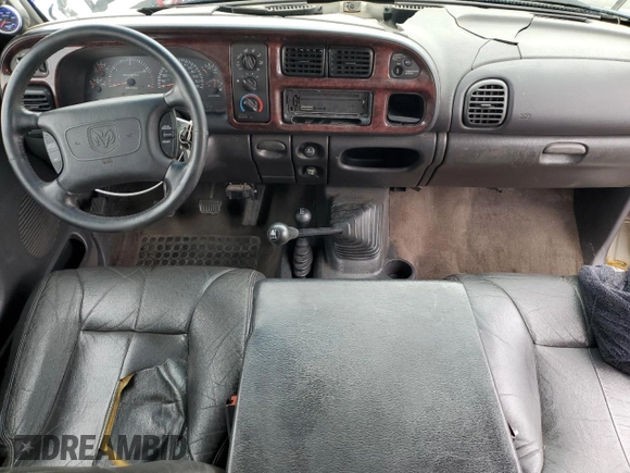 1999 Dodge 2500 z VIN 1B7KF2361XJ509781, wystawiony jako Copart lot #57282495 z przebiegiem 135 666 mil mil oraz Szkoda całkowita • Salvage title. Historia ofert i sprzedaży dostępna na DreamBid. Obrazek 8.