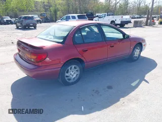 2000 Saturn SL z VIN 1G8ZK5274YZ241392, wystawiony jako IAAI lot #42168456 z przebiegiem 99 406 mil mil oraz . Historia ofert i sprzedaży dostępna na DreamBid. Obrazek 4.