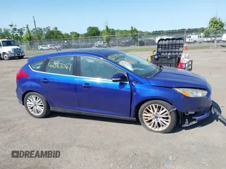 2015 Ford Focus Titanium z VIN 1FADP3N25FL291844, wystawiony jako IAAI lot #42383067 z przebiegiem 82 545 mil mil oraz . Historia ofert i sprzedaży dostępna na DreamBid. Obrazek 13.