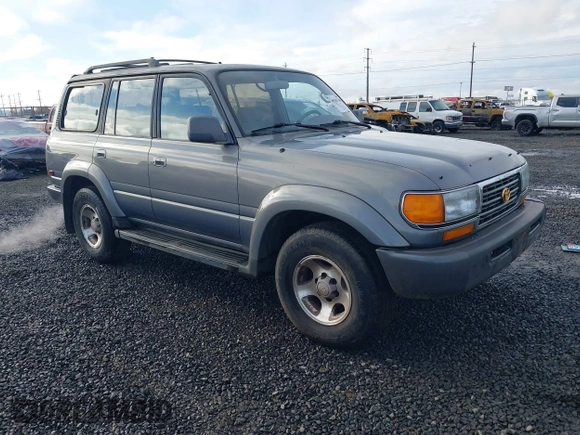 1995 Toyota Land Cruiser z VIN JT3DJ81W0S0094999, wystawiony jako IAAI lot #41583748 z przebiegiem 93 454 mil mil oraz . Historia ofert i sprzedaży dostępna na DreamBid. Obrazek 1.