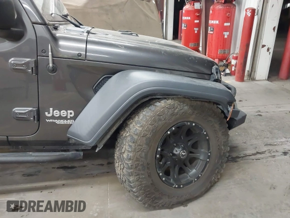 2020 Jeep Wrangler Sport S with VIN 1C4GJXAN4LW229040, listed as a IAAI auction lot 42172180 with 58,701 mi miles and . Bid and sale history available at DreamBid. Image 6.