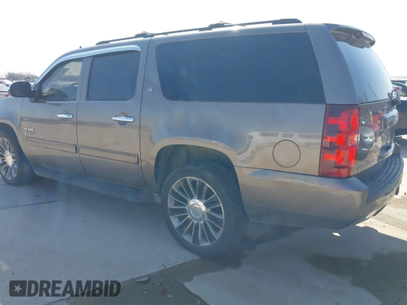 2011 Chevrolet Suburban LT with VIN 1GNSCJE03BR381301, listed as a IAAI auction lot 41412636 with 243,601 mi miles. Bid and sale history available at carsss.com. Image 3.