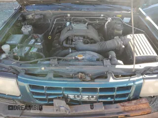 1999 Isuzu Rodeo S с VIN 4S2CK58W6X4352441, выставлен на аукционе Copart как лот 81915384 с пробегом 338 513 миль миль и На запчасти • Non repairable. История ставок и продаж доступна на DreamBid. Изображение 12.