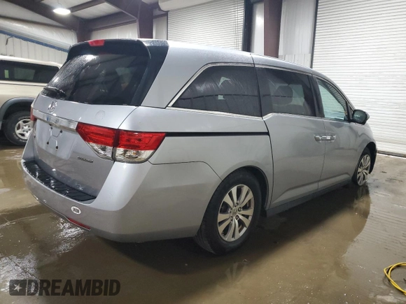 2016 Honda Odyssey SE with VIN 5FNRL5H31GB109718, listed as a Copart auction lot 54689915 with 48,933 mi miles and Salvage Title. Bid and sale history available at DreamBid. Image 3.