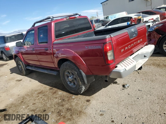 2003 Nissan Frontier XE with VIN 1N6ED27T13C409632, listed as a Copart auction lot 84884434 with 194,167 mi miles and Salvage title. Bid and sale history available at DreamBid. Image 2.