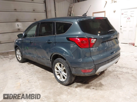 2019 Ford Escape SE z VIN 1FMCU9GDXKUA54699, wystawiony jako IAAI lot #41667188 z przebiegiem 127 376 mil mil oraz . Historia ofert i sprzedaży dostępna na DreamBid. Obrazek 3.