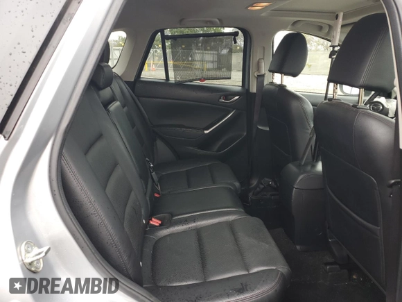 2016 Mazda CX-5 Grand Touring with VIN JM3KE2DY2G0894056, listed as a Copart auction lot 49247815 with 56,039 mi miles and Salvage Title. Bid and sale history available at carsss.com. Image 11.