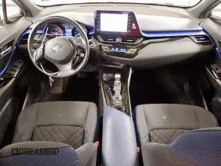 2021 Toyota C-HR LE z VIN NMTKHMBX0MR120577, wystawiony jako Copart lot #57019105 z przebiegiem 152 488 mil mil oraz Czysty tytuł • Clean title. Historia ofert i sprzedaży dostępna na DreamBid. Obrazek 8.