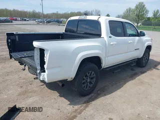 2023 Toyota Tacoma SR with VIN 3TMCZ5AN2PM642205, listed as a IAAI auction lot 42167945 with 10,595 mi miles and . Bid and sale history available at DreamBid. Image 4.