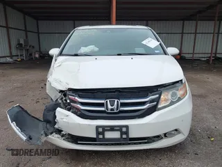2014 Honda Odyssey Touring with VIN 5FNRL5H95EB059729, listed as a IAAI auction lot 42148110 with 135,304 mi miles and . Bid and sale history available at DreamBid. Image 13.