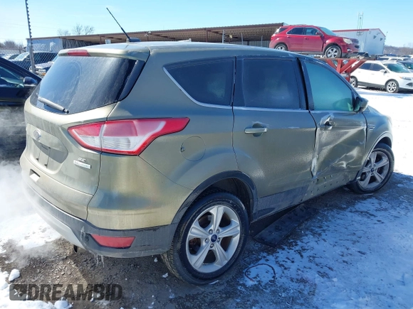 2013 Ford Escape SE with VIN 1FMCU0GX4DUC60741, listed as a IAAI auction lot 41592770 with 121,972 mi miles and . Bid and sale history available at DreamBid. Image 4.
