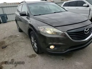 2015 Mazda CX-9 Grand Touring z VIN JM3TB2DA0F0468350, wystawiony jako Copart lot #61545095 z przebiegiem 154 050 mil mil oraz Szkoda całkowita • Salvage title. Historia ofert i sprzedaży dostępna na DreamBid. Obrazek 14.