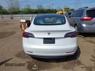 2020 Tesla Model 3 Standard Range Plus with VIN 5YJ3E1EA3LF785951, listed as a IAAI auction lot 41919339 with 63,025 mi miles and . Bid and sale history available at carsss.com. Image 15.