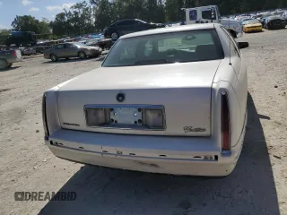 1999 Cadillac DeVille z VIN 1G6KD54YXXU794473, wystawiony jako Copart lot #79774804 z przebiegiem 44 601 mil mil oraz Czysty tytuł • Clean title. Historia ofert i sprzedaży dostępna na DreamBid. Obrazek 6.