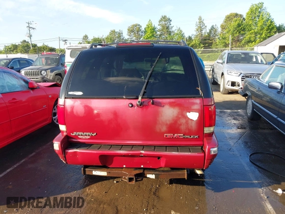 1995 GMC Jimmy SLE z VIN 1GKDT13W1SK528155, wystawiony jako IAAI lot #42177589 z przebiegiem 283 900 mil mil oraz . Historia ofert i sprzedaży dostępna na DreamBid. Obrazek 16.