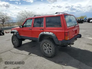 1996 Jeep Cherokee Sport with VIN 1J4FJ68S6TL213886, listed as a Copart auction lot 51462275 with 215,091 mi miles and Salvage title. Bid and sale history available at DreamBid. Image 2.