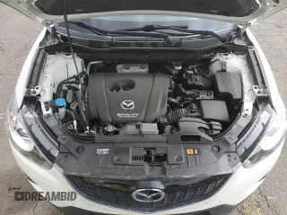 2014 Mazda CX-5 Grand Touring with VIN JM3KE4DY2E0354795, listed as a Copart auction lot 70713544 with 58,848 mi miles and Salvage Title. Bid and sale history available at DreamBid. Image 11.