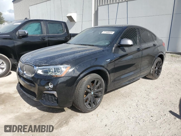 2017 BMW X4 M40i with VIN 5UXXW7C51H0U25766, listed as a Copart auction lot 77749324 with 101,289 mi miles and Salvage Title. Bid and sale history available at carsss.com. Image 1.