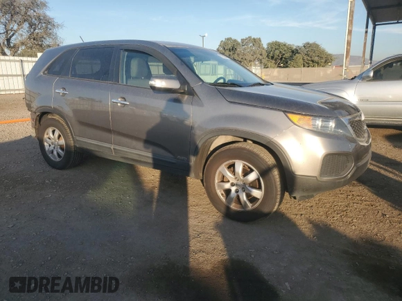 2012 Kia Sorento LX with VIN 5XYKTCA62CG255185, listed as a Copart auction lot 87242304 with 124,224 mi miles and Salvage Title. Bid and sale history available at DreamBid. Image 4.