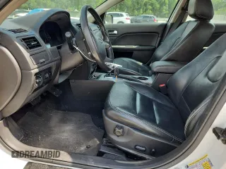 2010 Ford Fusion Hybrid z VIN 3FADP0L39AR152224, wystawiony jako Copart lot #60549615 z przebiegiem 118 939 mil mil oraz Szkoda całkowita • Salvage title. Historia ofert i sprzedaży dostępna na DreamBid. Obrazek 7.