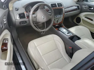 2010 Jaguar XK with VIN SAJWA4GB4ALB37114, listed as a Copart auction lot 77673824 with 99,999 mi miles and Salvage Title. Bid and sale history available at carsss.com. Image 8.