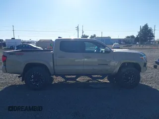 2018 Toyota Tacoma SR z VIN 3TMCZ5AN7JM125425, wystawiony jako IAAI lot #40459066 z przebiegiem 85 182 mil mil oraz . Historia ofert i sprzedaży dostępna na DreamBid. Obrazek 13.