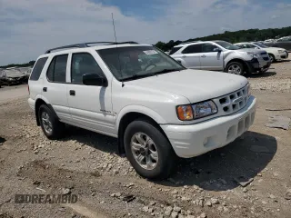 2001 Isuzu Rodeo S z VIN 4S2DM58W414330847, wystawiony jako Copart lot #64028134 z przebiegiem 160 027 mil mil oraz Tytuł czysty. Historia ofert i sprzedaży dostępna na DreamBid. Obrazek 4.
