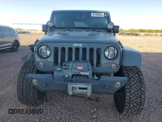 2014 Jeep Wrangler Unlimited Rubicon with VIN 1C4HJWFG9EL199501, listed as a Copart auction lot 61443595 with 86,940 mi miles and Salvage title. Bid and sale history available at DreamBid. Image 5.
