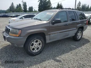 1999 Jeep Grand Cherokee Laredo z VIN 1J4G258S9XC526464, wystawiony jako Copart lot #61952905 z przebiegiem 114 181 mil mil oraz Szkoda całkowita • Salvage title. Historia ofert i sprzedaży dostępna na DreamBid. Obrazek 1.