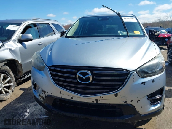 2016 Mazda CX-5 Grand Touring with VIN JM3KE4DY9G0795360, listed as a IAAI auction lot 41933991 with 176,373 mi miles. Bid and sale history available at carsss.com. Image 12.