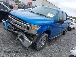 2019 Ford F-150 XL with VIN 1FTFW1E58KFA68470, listed as a IAAI auction lot 40823381 with 174,401 mi miles and . Bid and sale history available at DreamBid. Image 18.
