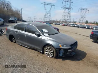 2014 Volkswagen Jetta SE z VIN 3VWD17AJ9EM284051, wystawiony jako IAAI lot #41770392 z przebiegiem 13 734 mil mil oraz . Historia ofert i sprzedaży dostępna na DreamBid. Obrazek 1.