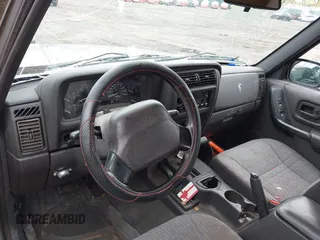 2000 Jeep Cherokee z VIN 1J4FF48S1YL131481, wystawiony jako IAAI lot #41947074 z przebiegiem Nie podano mil oraz . Historia ofert i sprzedaży dostępna na DreamBid. Obrazek 12.