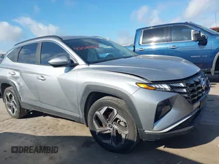 2022 Hyundai Tucson SEL z VIN 5NMJFCAE6NH122142, wystawiony jako IAAI lot #42520628 z przebiegiem 69 602 mil mil oraz . Historia ofert i sprzedaży dostępna na DreamBid. Obrazek 1.