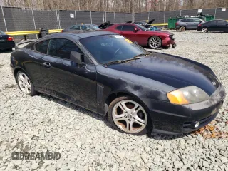 2003 Hyundai Tiburon GT z VIN KMHHN65F13U084620, wystawiony jako Copart lot #46880185 z przebiegiem Nie podano mil oraz Nie do naprawy • Non repairable. Historia ofert i sprzedaży dostępna na DreamBid. Obrazek 4.