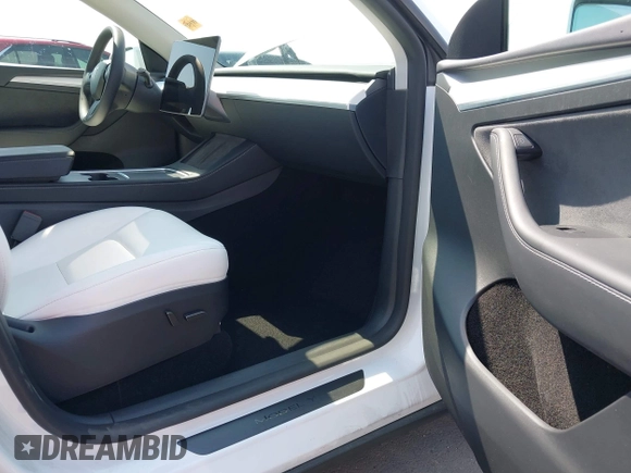 2024 Tesla Model Y with VIN 7SAYGDED8RF201955, listed as a IAAI auction lot 42700483 with 11,898 mi miles and . Bid and sale history available at DreamBid. Image 5.