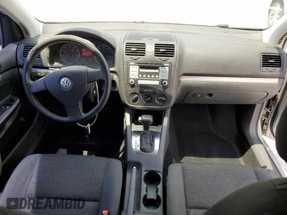 2009 Volkswagen Rabbit S с VIN WVWBA71KX9W048212, выставлен на аукционе Copart как лот 60592825 с пробегом 141 893 миль миль и Списание • Salvage title. История ставок и продаж доступна на DreamBid. Изображение 8.
