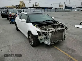 2013 Scion tC z VIN JTKJF5C77D3056779, wystawiony jako Copart lot #57459935 z przebiegiem 157 420 mil mil oraz Szkoda całkowita • Salvage title. Historia ofert i sprzedaży dostępna na DreamBid. Obrazek 13.