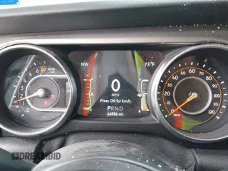 2020 Jeep Wrangler Sport S with VIN 1C4GJXAG1LW103235, listed as a IAAI auction lot 42126250 with 64,986 mi miles and . Bid and sale history available at DreamBid. Image 7.