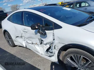 2023 Toyota Prius LE with VIN JTDACAAUXP3012538, listed as a IAAI auction lot 41948103 with 33,338 mi miles and . Bid and sale history available at DreamBid. Image 6.