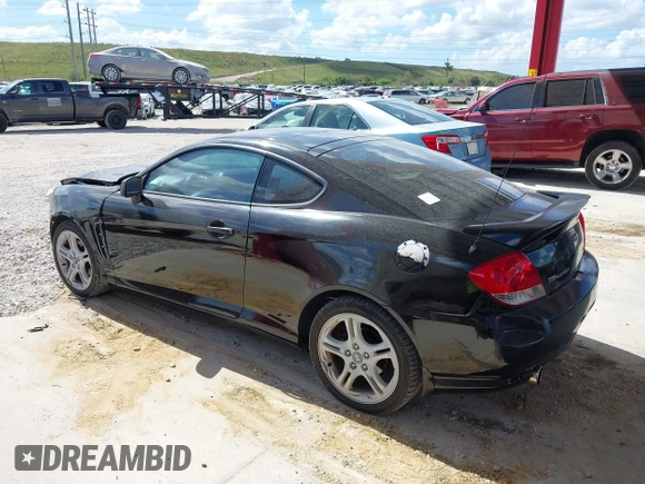2006 Hyundai Tiburon GT z VIN KMHHN65F56U224768, wystawiony jako IAAI lot #40672721 z przebiegiem 158 535 mil mil oraz . Historia ofert i sprzedaży dostępna na DreamBid. Obrazek 15.
