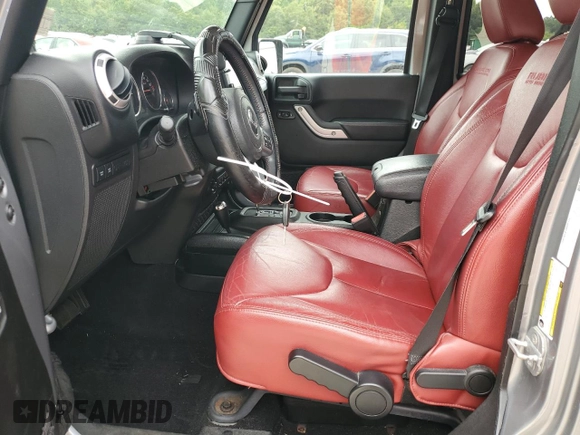 2013 Jeep Wrangler Unlimited Rubicon 10th Anniversary z VIN 1C4HJWFG3DL703331, wystawiony jako Copart lot #70823154 z przebiegiem 148 860 mil mil oraz Szkoda całkowita • Salvage title. Historia ofert i sprzedaży dostępna na DreamBid. Obrazek 7.
