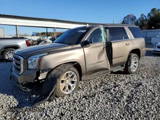 2015 GMC Yukon SLT with VIN 1GKS1BKC8FR664001, listed as a Copart auction lot 84391784 with 0 mi miles and Salvage Title. Bid and sale history available at carsss.com. Image 1.