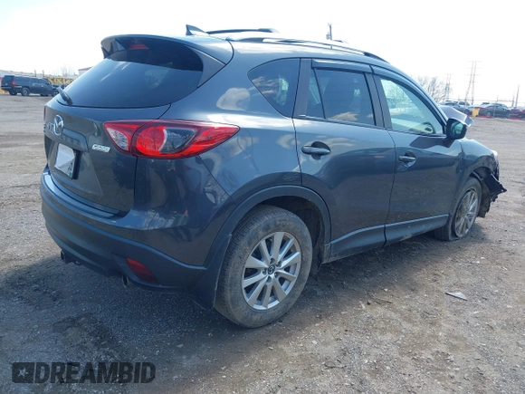 2016 Mazda CX-5 Touring with VIN JM3KE4CYXG0620990, listed as a IAAI auction lot 41978738 with 91,237 mi miles and . Bid and sale history available at carsss.com. Image 4.