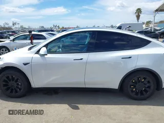2020 Tesla Model Y Long Range with VIN 5YJYGDEE2LF058515, listed as a IAAI auction lot 41932748 with 62,885 mi miles and . Bid and sale history available at DreamBid. Image 14.