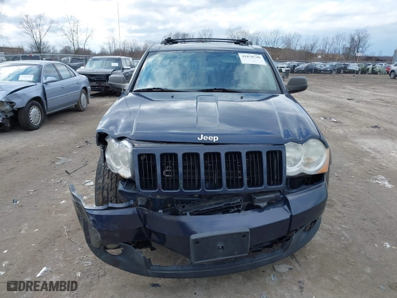 2010 Jeep Grand Cherokee Laredo with VIN 1J4PR4GK5AC138498, listed as a IAAI auction lot 41870740 with 130,551 mi miles. Bid and sale history available at carsss.com. Image 12.