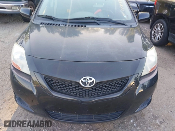2009 Toyota Yaris with VIN JTDBT903894044347, listed as a IAAI auction lot 42069061 with 197,348 mi miles. Bid and sale history available at carsss.com. Image 6.