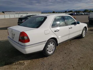 1995 Mercedes-Benz C with VIN WDBHA28E1SF151911, listed as a Copart auction lot 76814424 with 128,184 mi miles and Clean Title. Bid and sale history available at carsss.com. Image 3.